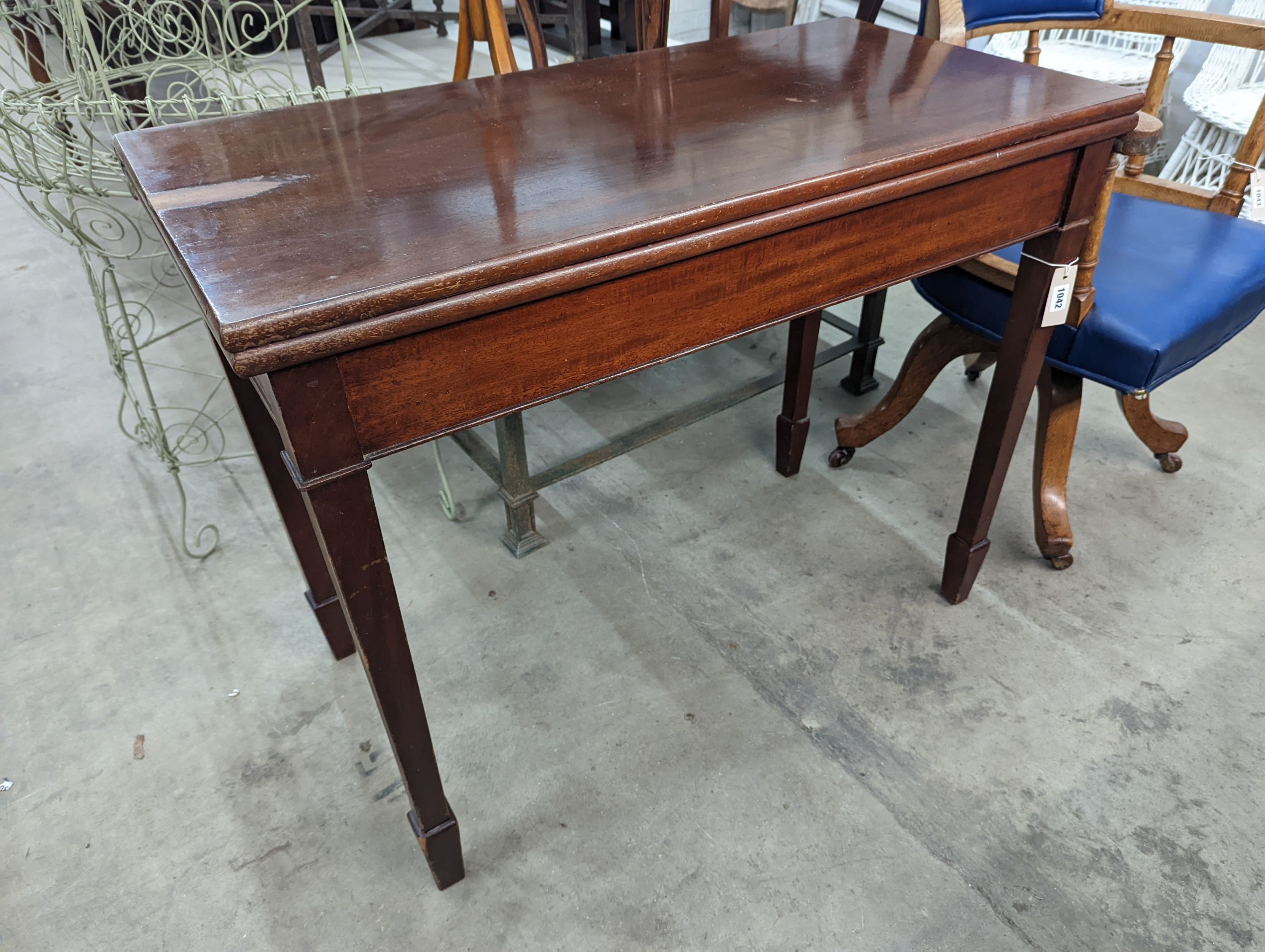 An Edwardian rectangular mahogany folding tea table, width 92cm, depth 46cm, height 75cm